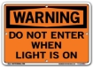 WARNING - Do Not Enter When Light Is On signs. Choose from 28 different materials for each sign. Part #: SI-W-69-GRP